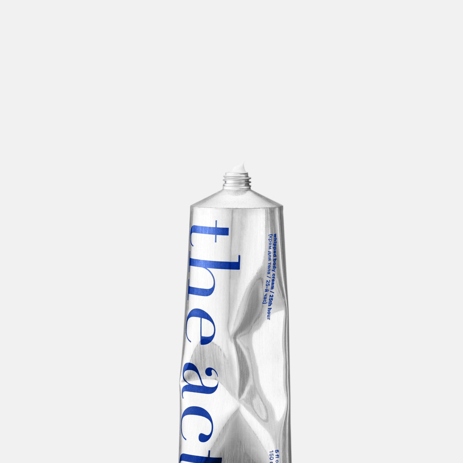 Silver tube with 'theact' branding on a white background