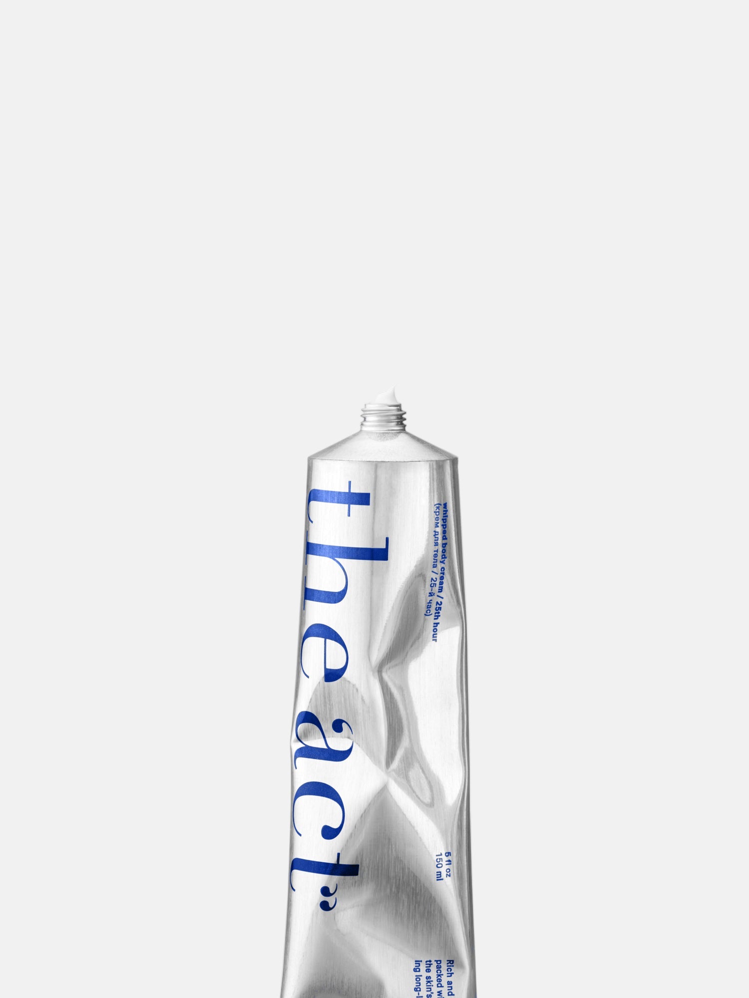 Silver tube with 'theact' branding on a white background